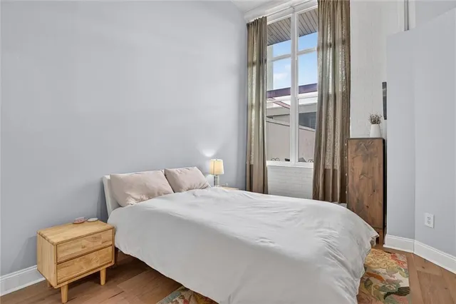 a bedroom with a bed and a dresser