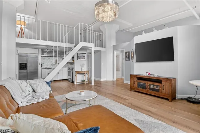 a living room with furniture and a flat screen tv