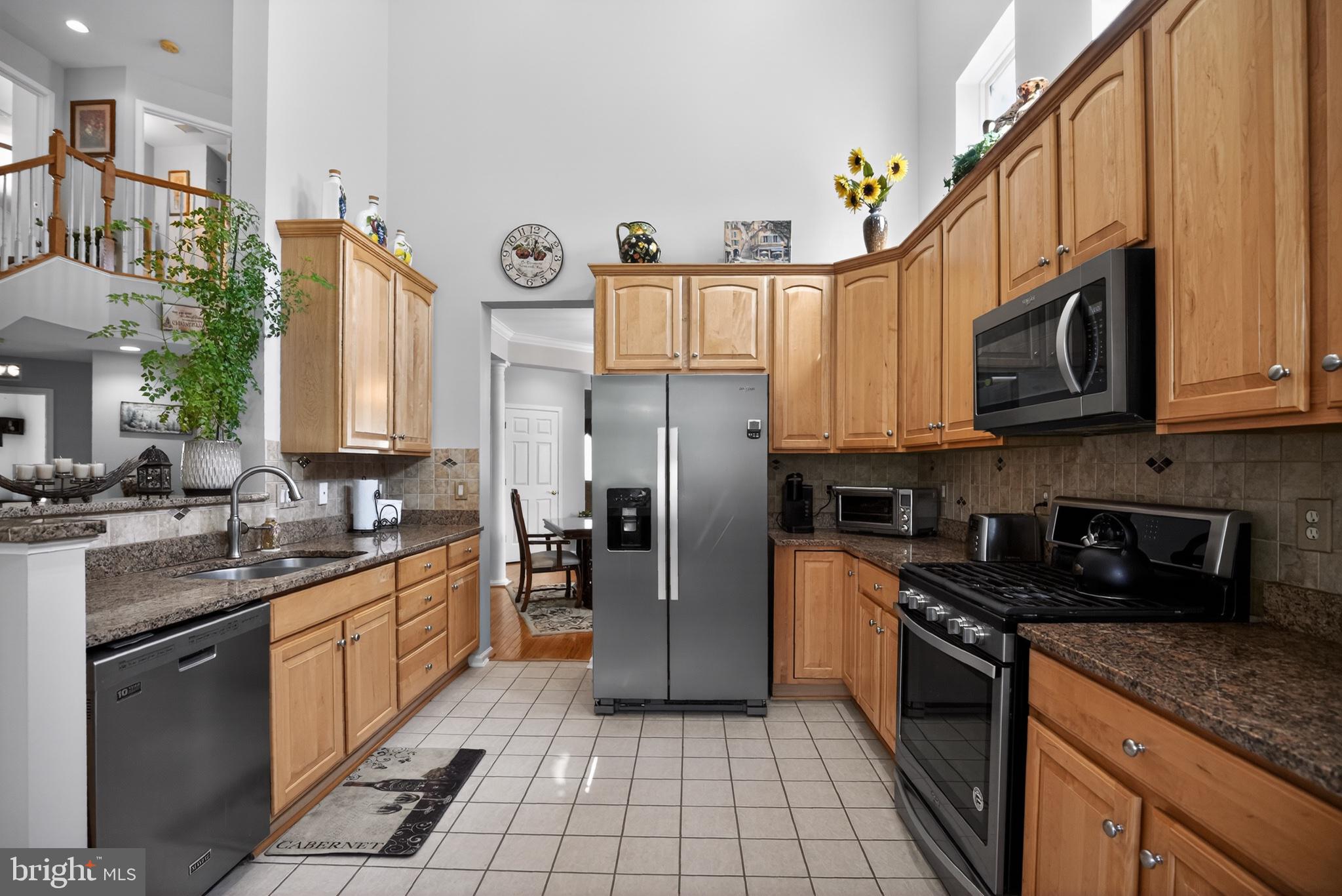 9 Simpkins Lane Pemberton, NJ 08068 - Photo 17 of 36 Modern kitchen with warm wood tones.