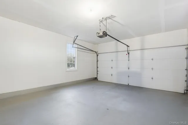 a view of a room with white walls