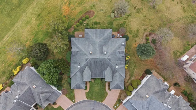 an aerial view of a house with outdoor space