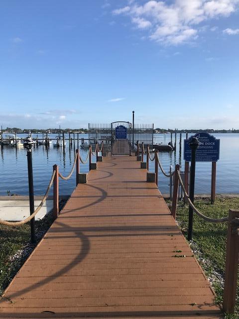 825 Center Street, Unit 1B Jupiter, FL 33458 - Photo 13 of 16 a park with wooden benches and city view