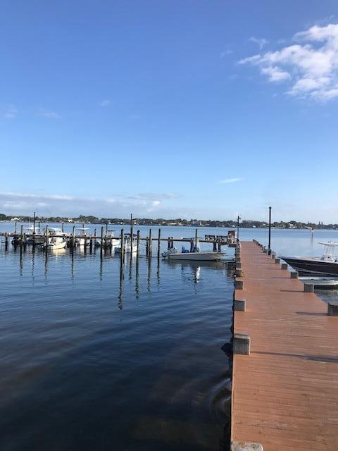 825 Center Street, Unit 1B Jupiter, FL 33458 - Photo 14 of 16 a view of ocean with boats and trees in the background