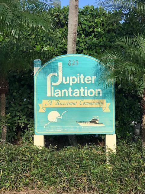825 Center Street, Unit 1B Jupiter, FL 33458 - Photo 2 of 16 a sign on the side of a road