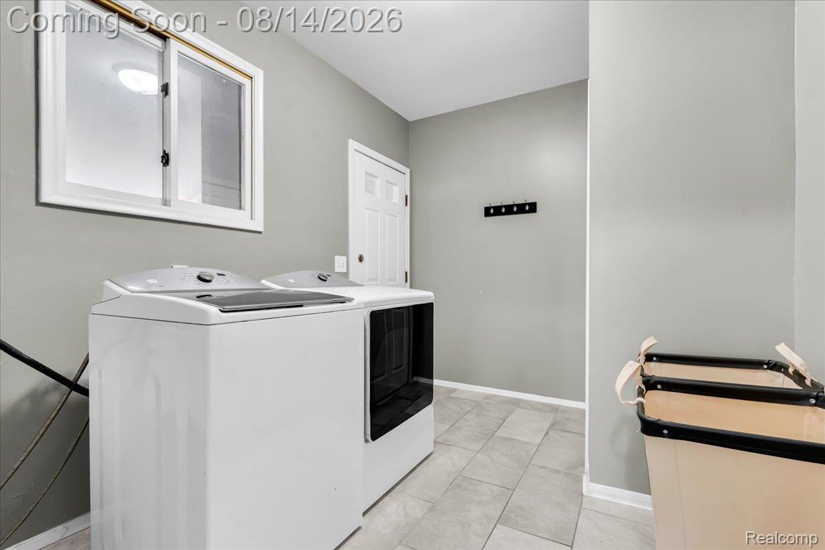 47321 Susan Road Macomb, MI 48044 - Photo 20 of 46 White-framed window and gray walls above tiled flooring