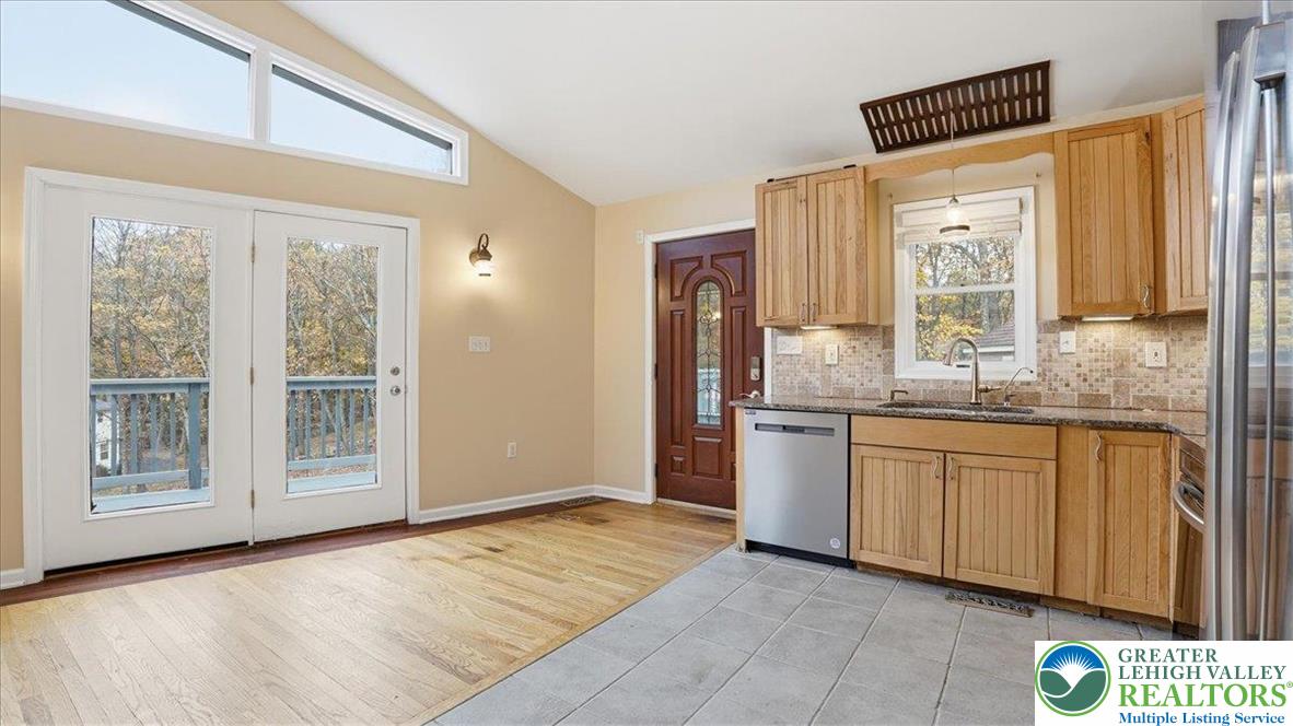 2318 Sunbird Court Scotrun, PA 18355 - Photo 17 of 56 a kitchen with stainless steel appliances granite countertop a refrigerator and a sink