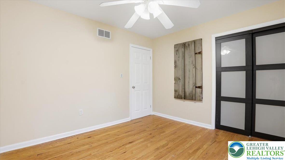 2318 Sunbird Court Scotrun, PA 18355 - Photo 25 of 56 wooden floor in an empty room with a window