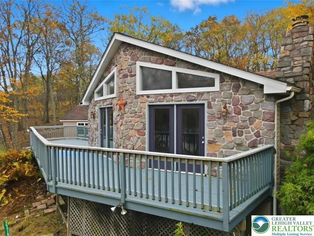 2318 Sunbird Court Scotrun, PA 18355 - Photo 3 of 56 a balcony with wooden floor and fence