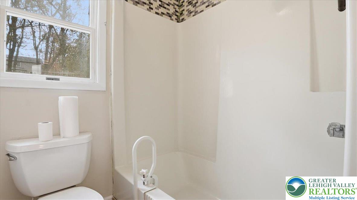 2318 Sunbird Court Scotrun, PA 18355 - Photo 31 of 56 a white toilet sitting next to a bathroom sink