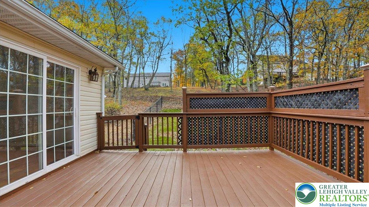 2318 Sunbird Court Scotrun, PA 18355 - Photo 36 of 56 a view of a balcony with wooden floor and fence