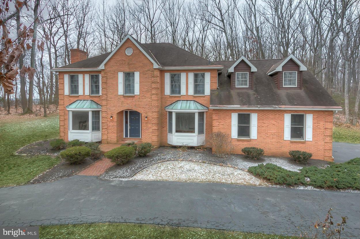 15710 Yeoho Road Sparks, MD 21152 - Photo 1 of 30 a front view of a house with a yard and garage