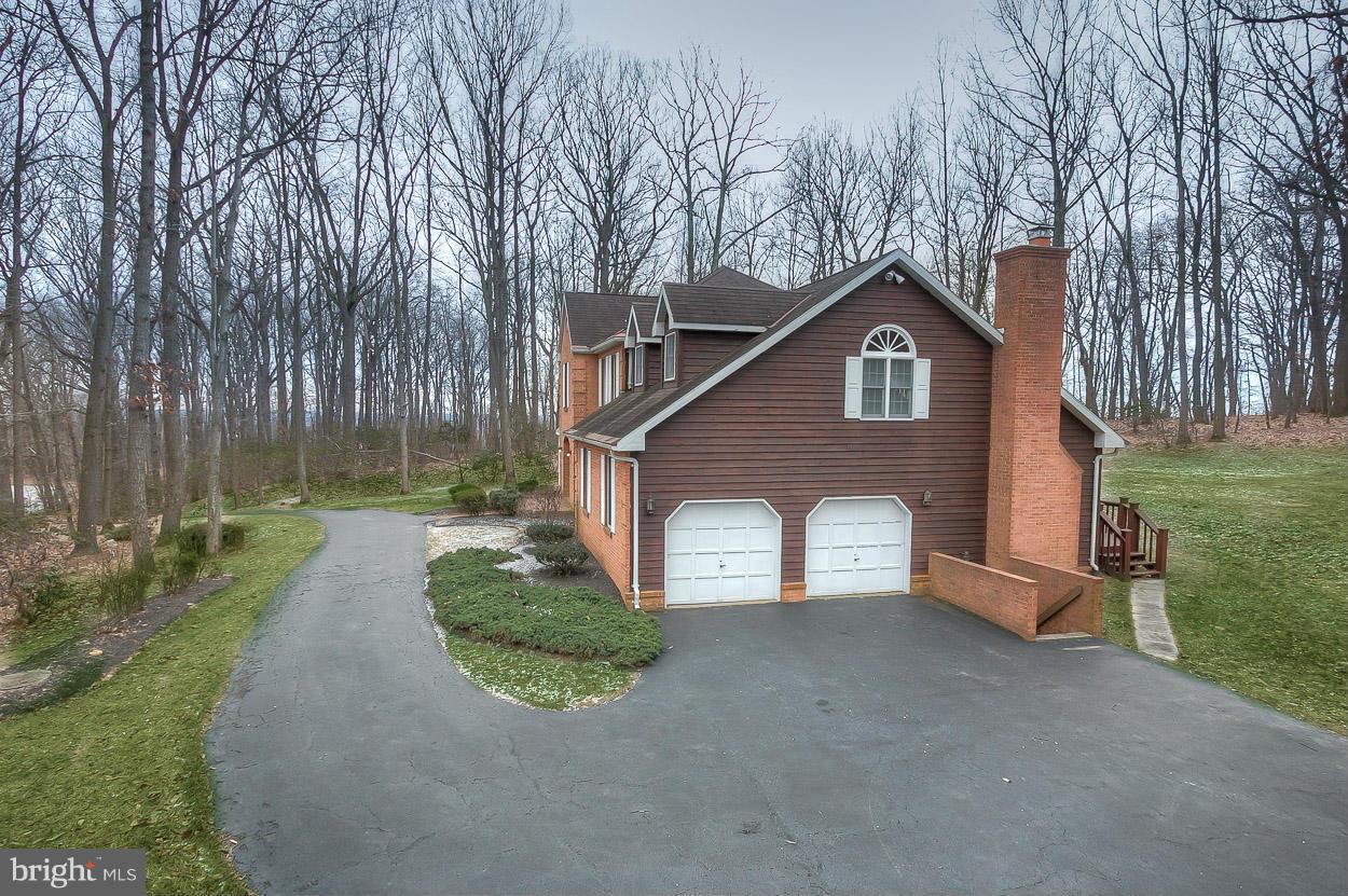 15710 Yeoho Road Sparks, MD 21152 - Photo 2 of 30 a view of a house with a yard and large tree
