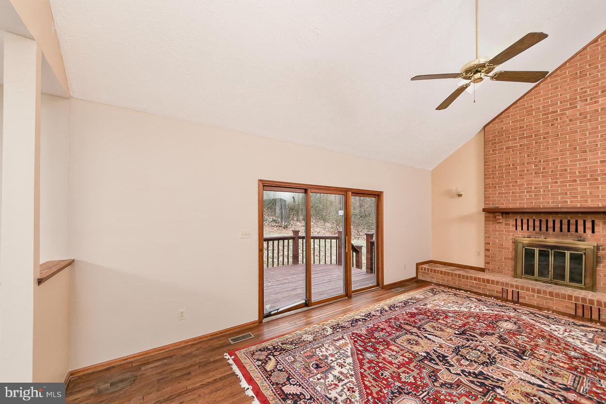 15710 Yeoho Road Sparks, MD 21152 - Photo 12 of 30 a view of a bedroom with wooden floor and a window