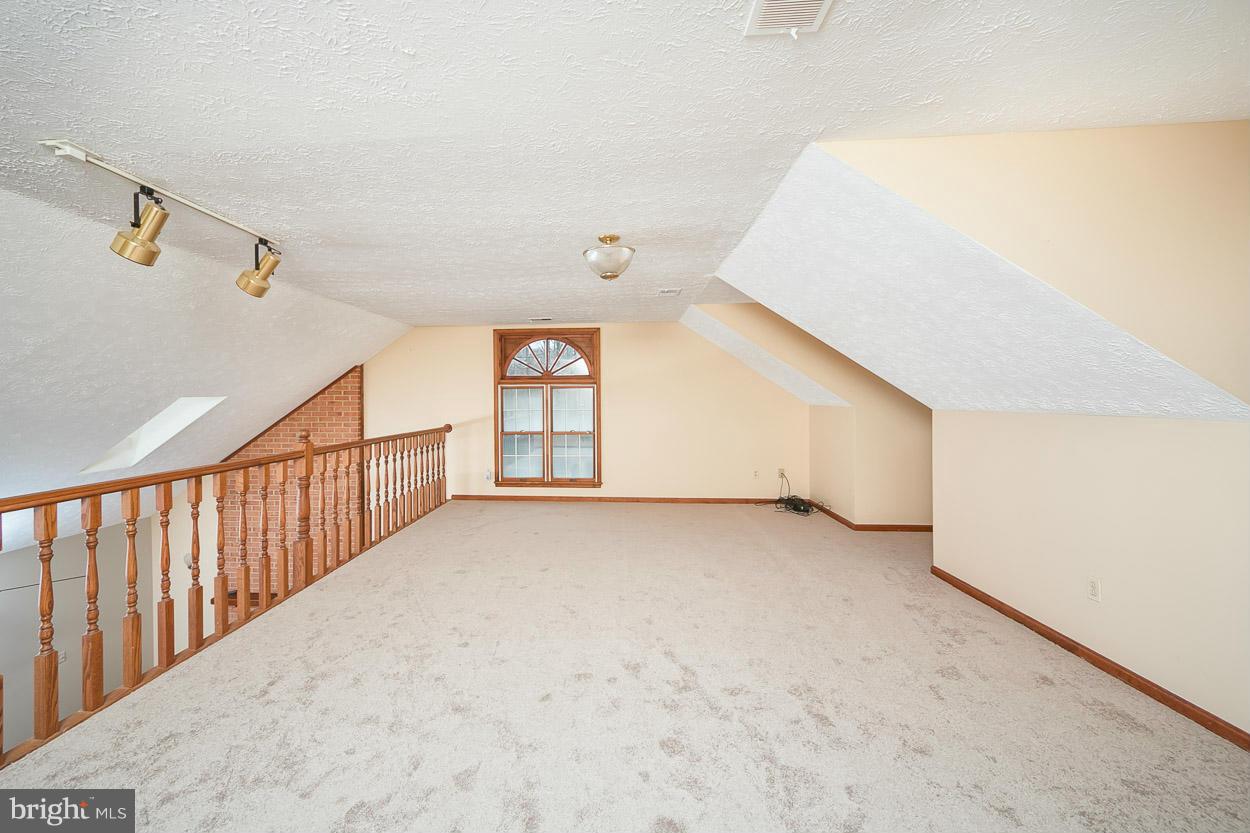 15710 Yeoho Road Sparks, MD 21152 - Photo 13 of 30 a view of an empty room with windows