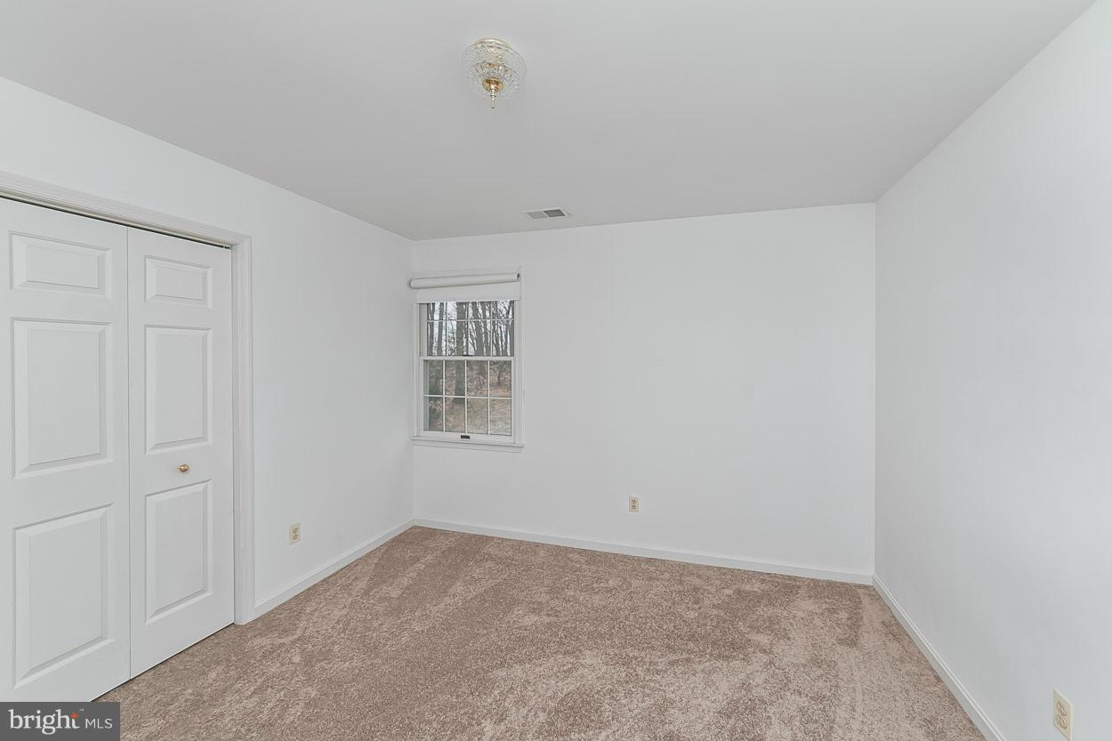 15710 Yeoho Road Sparks, MD 21152 - Photo 19 of 30 an empty room with windows