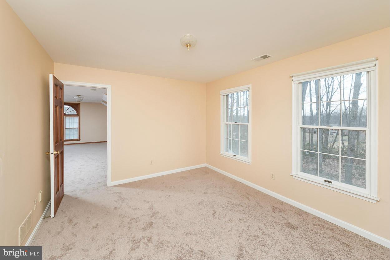 15710 Yeoho Road Sparks, MD 21152 - Photo 20 of 30 an empty room with windows and closet