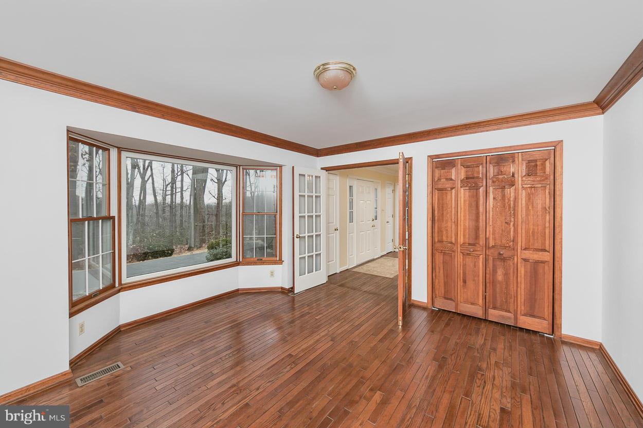 15710 Yeoho Road Sparks, MD 21152 - Photo 3 of 30 a view of empty room with wooden floor and fan