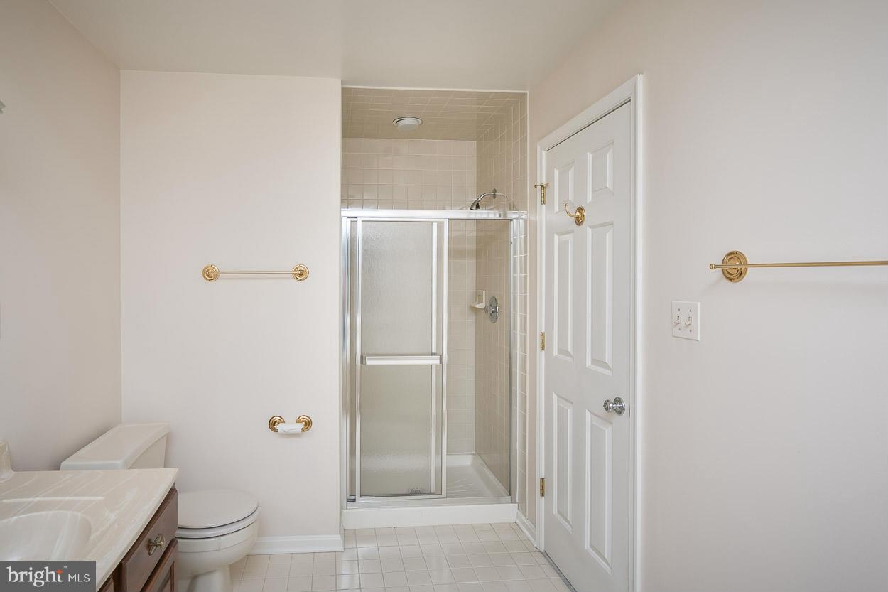 15710 Yeoho Road Sparks, MD 21152 - Photo 24 of 30 a bathroom with a granite countertop sink mirror and toilet