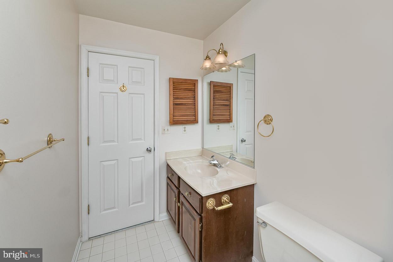 15710 Yeoho Road Sparks, MD 21152 - Photo 25 of 30 a bathroom with a sink a vanity and a mirror