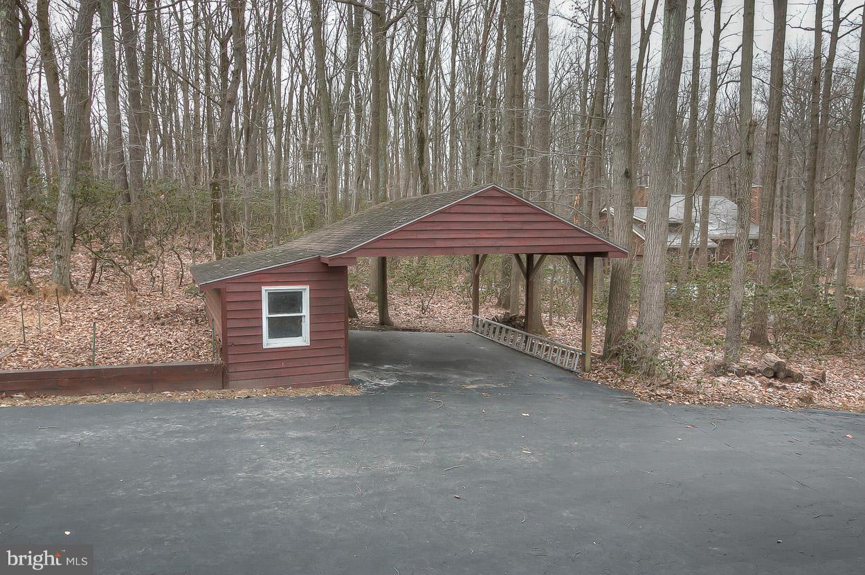 15710 Yeoho Road Sparks, MD 21152 - Photo 29 of 30 a view of a house with a yard and sitting area