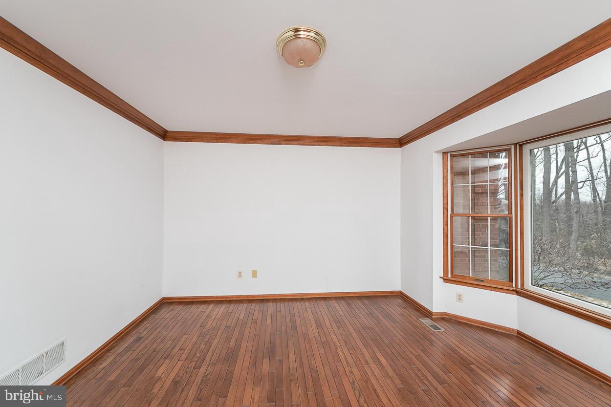 15710 Yeoho Road Sparks, MD 21152 - Photo 4 of 30 a view of a room with wooden floor and fan