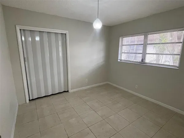 an empty room with a empty space and windows