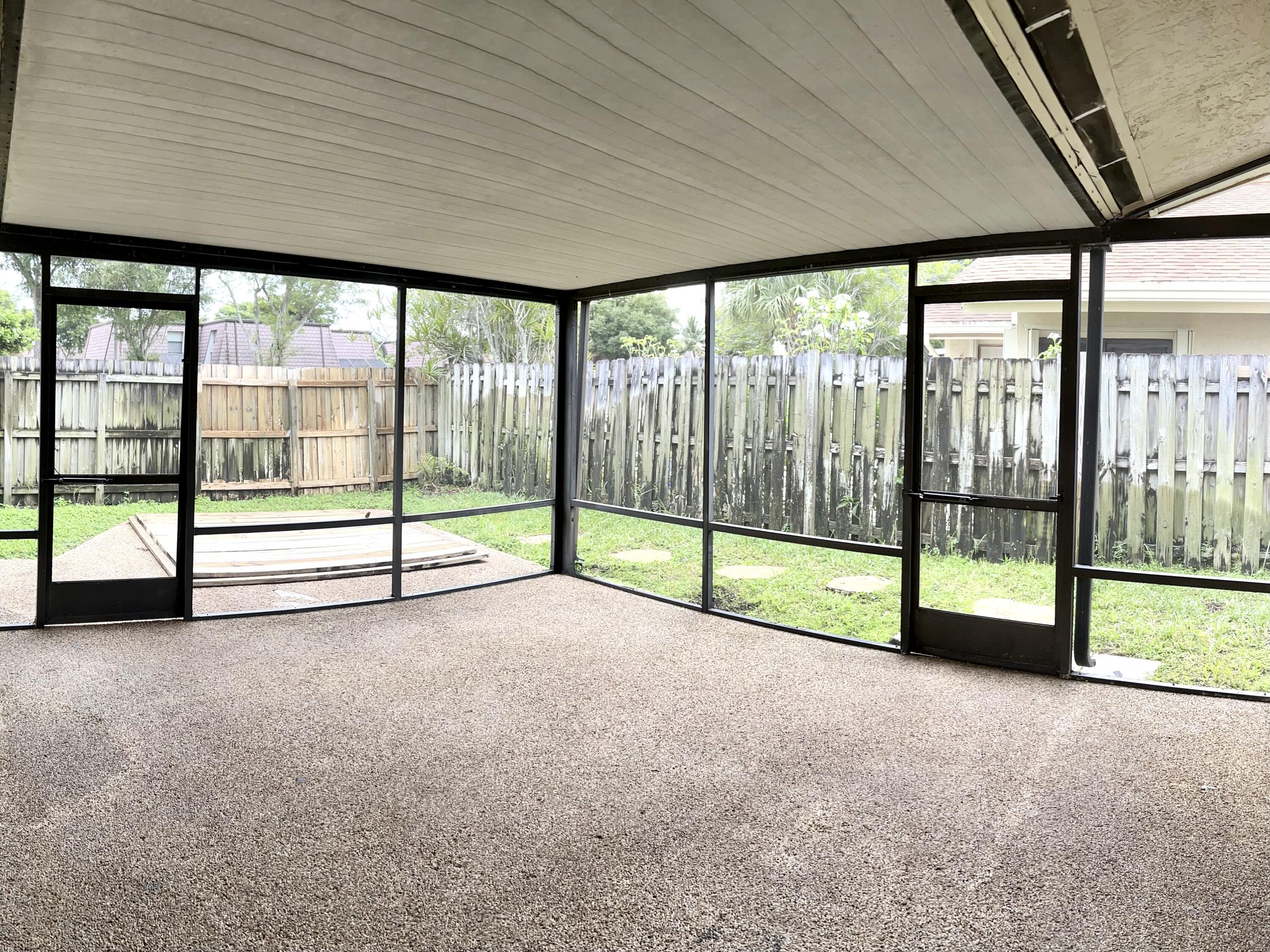 7614 Sierra Terrace West Boca Raton, FL 33433 - Photo 16 of 20 a view of an empty room with sliding door