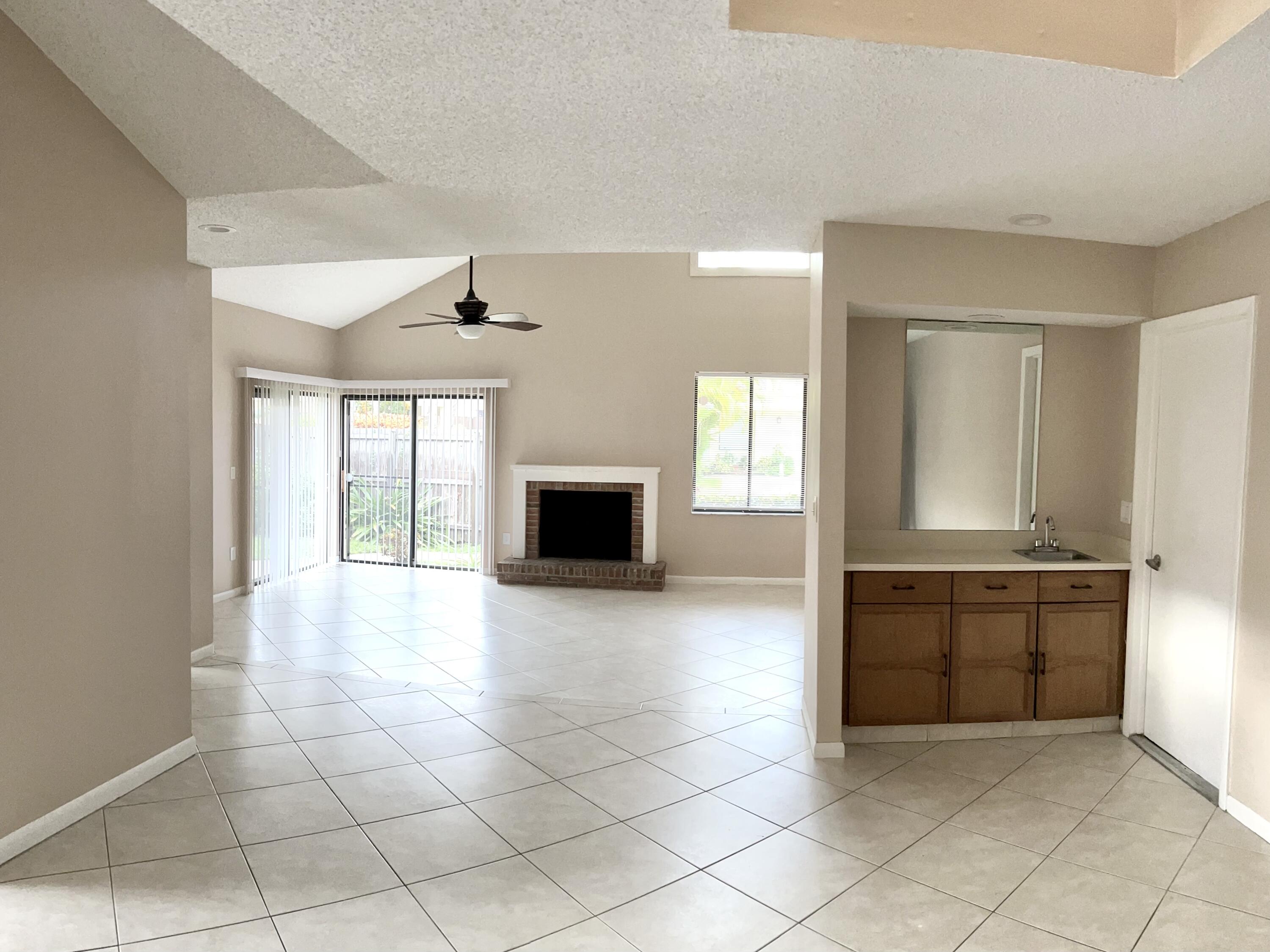 7614 Sierra Terrace West Boca Raton, FL 33433 - Photo 5 of 20 a view of a kitchen with a sink and a stove top oven
