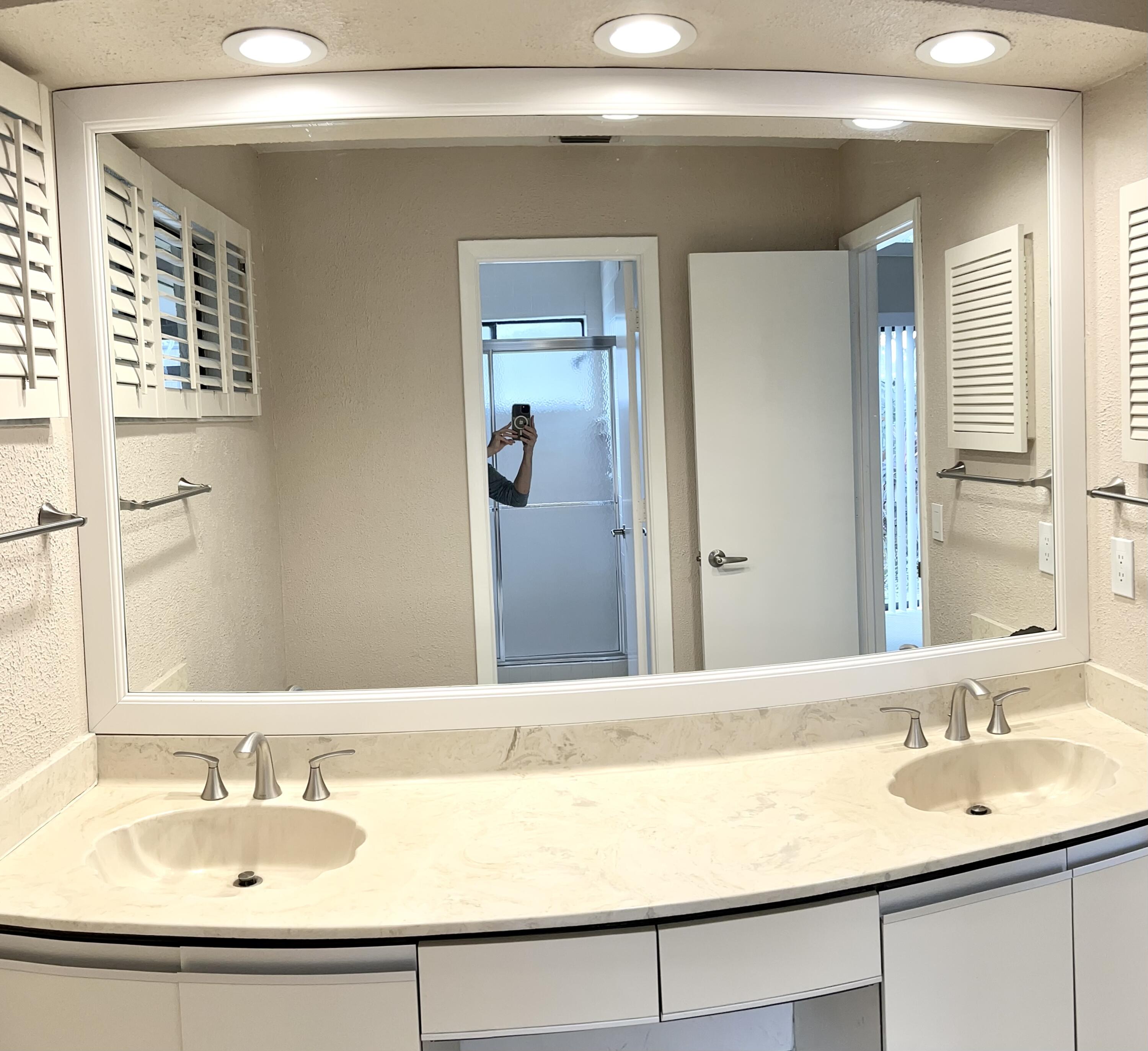 7614 Sierra Terrace West Boca Raton, FL 33433 - Photo 8 of 20 a bathroom with a sink and a mirror