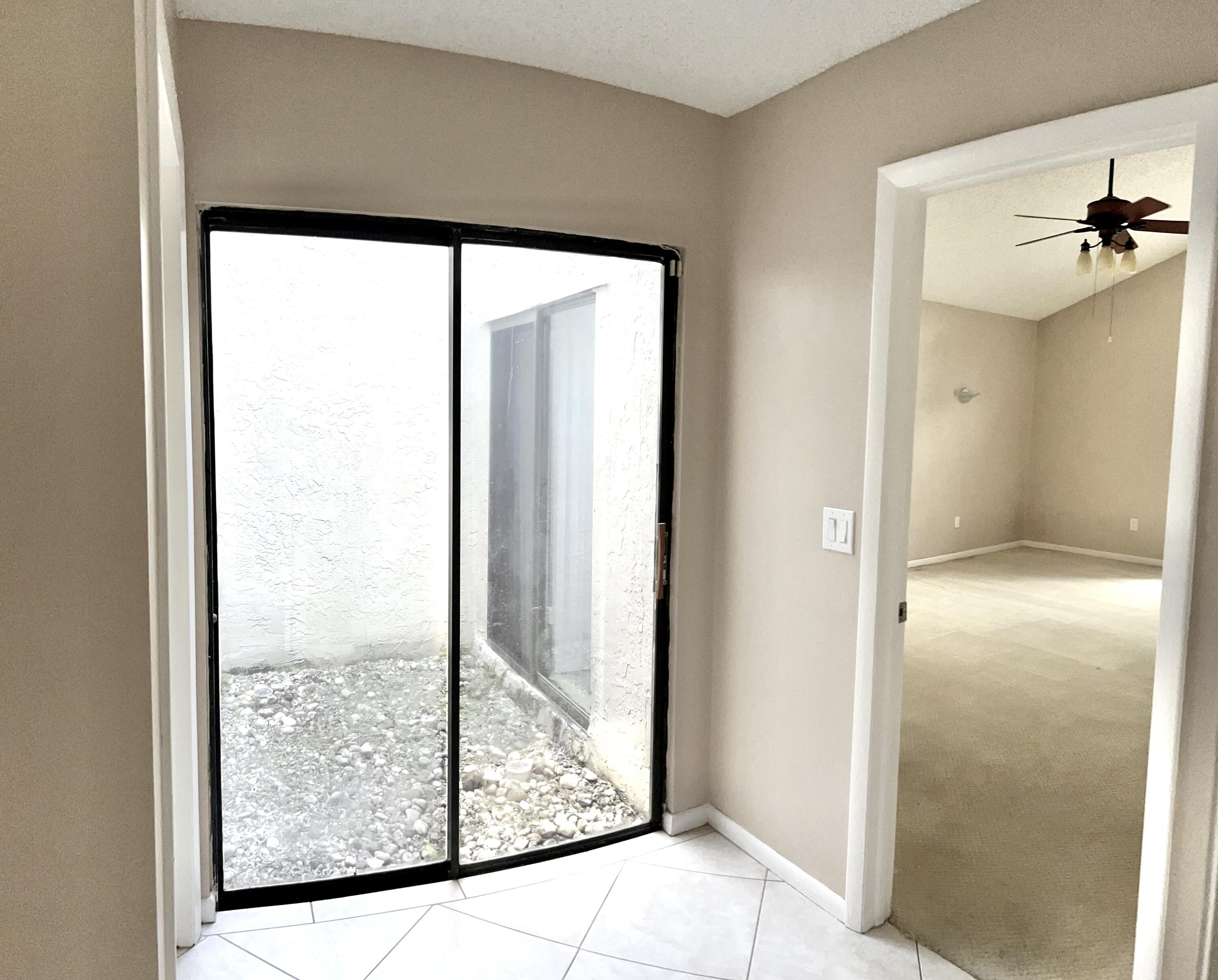 7614 Sierra Terrace West Boca Raton, FL 33433 - Photo 10 of 20 a view interior of the house and window