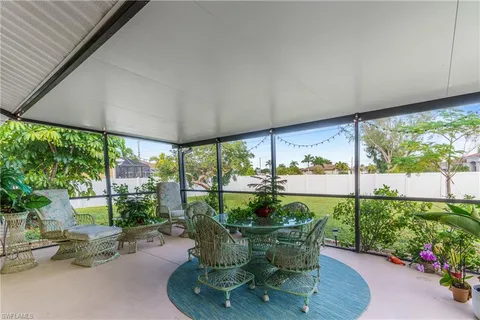 a view of a dining room with furniture garden and plants