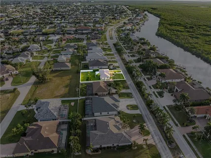 an aerial view of house with yard