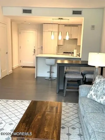 a bathroom with a sink toilet and mirror