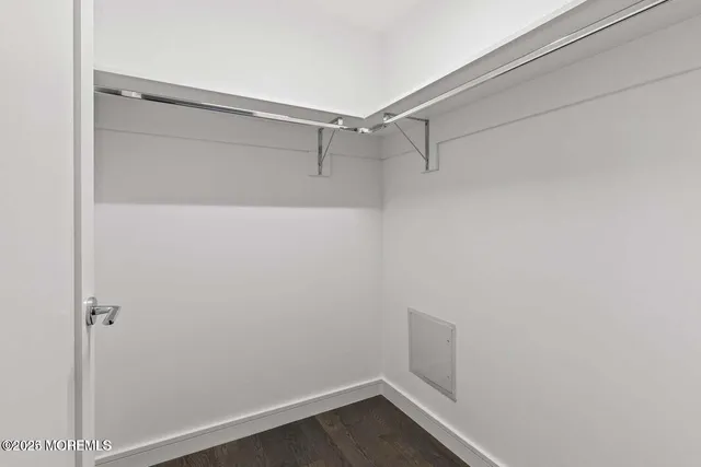 a view of a living room and floor to ceiling window