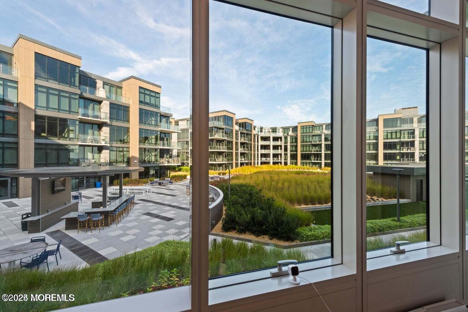 15 Morris Avenue, Unit 308 Long Branch, NJ 07740 - Photo 20 of 48 a view of a living room and floor to ceiling window