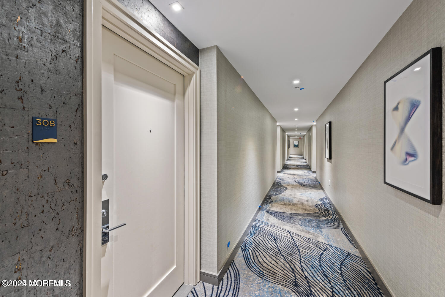 15 Morris Avenue, Unit 308 Long Branch, NJ 07740 - Photo 23 of 48 a view of a hallway with wooden floor and staircase