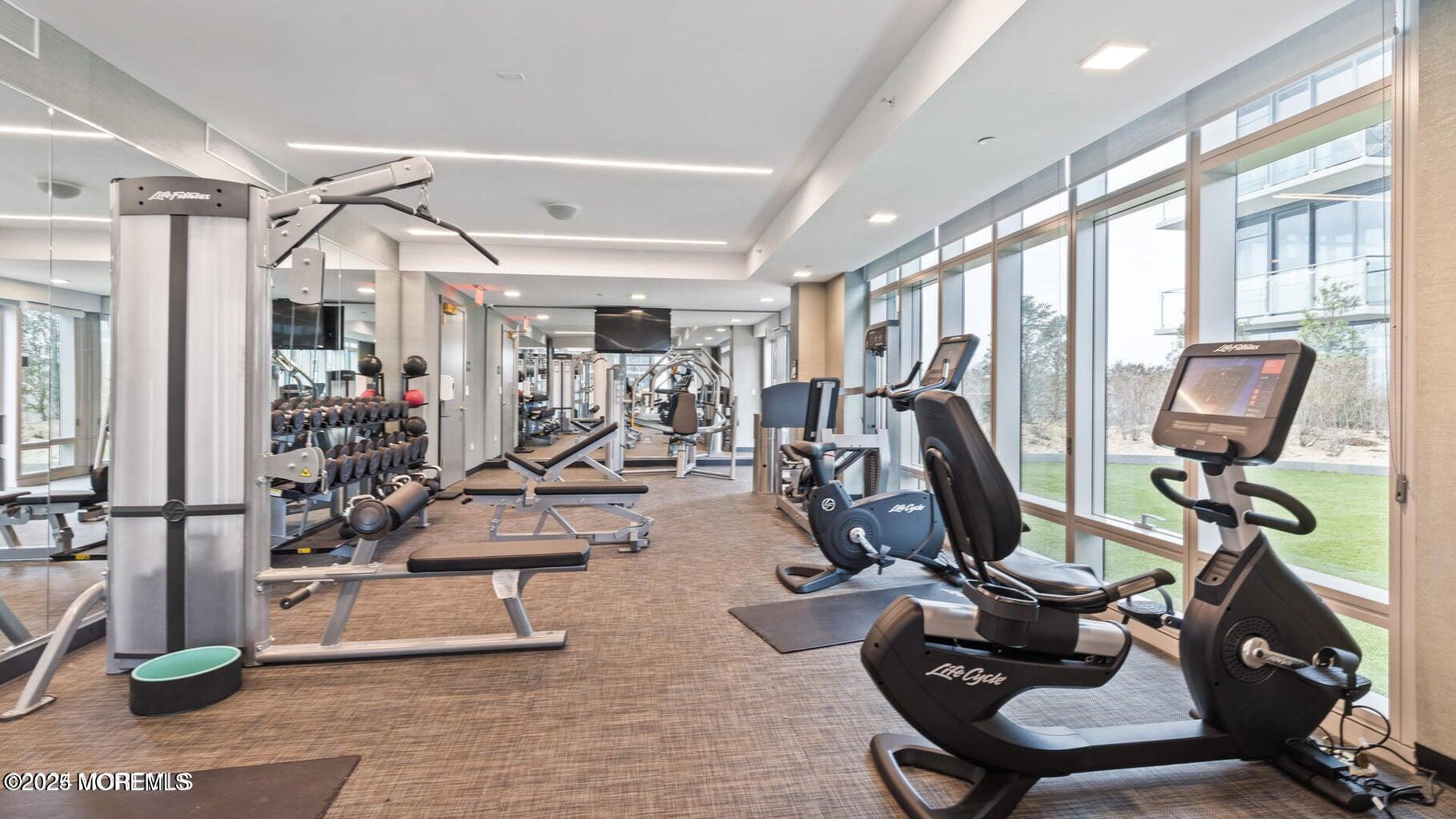 15 Morris Avenue, Unit 308 Long Branch, NJ 07740 - Photo 28 of 48 a view of a room with gym equipment