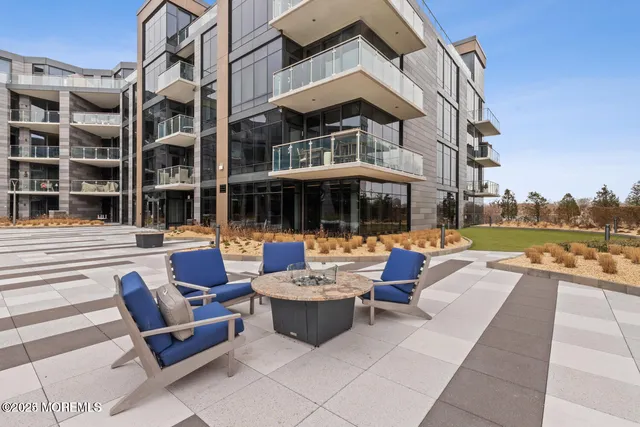 a view of a chairs and table in the patio