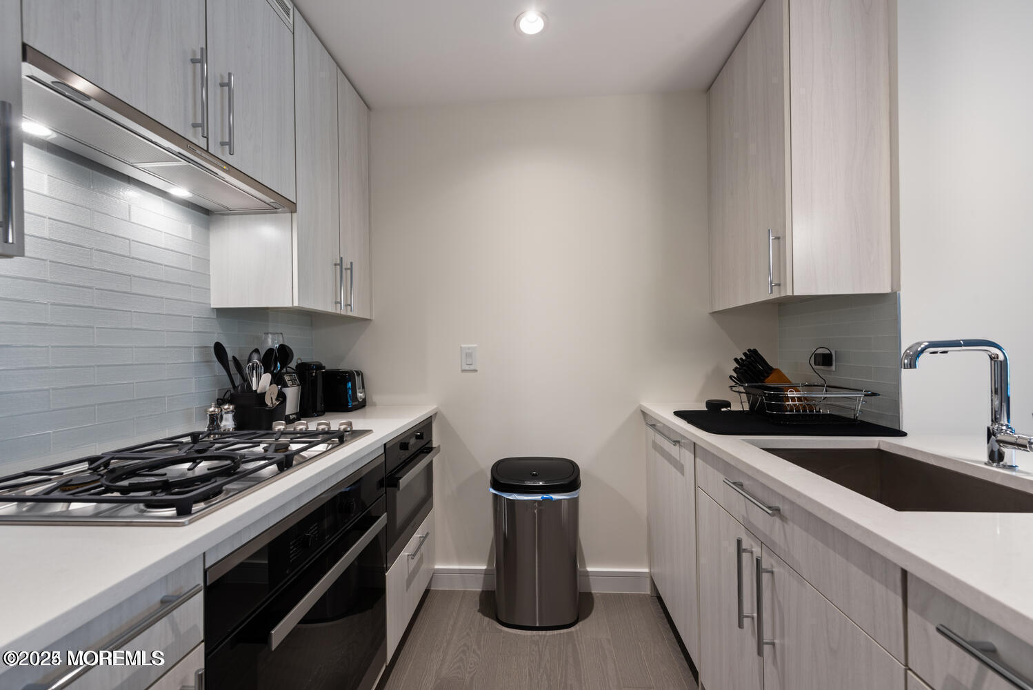 15 Morris Avenue, Unit 308 Long Branch, NJ 07740 - Photo 5 of 48 a kitchen with a stove and a sink
