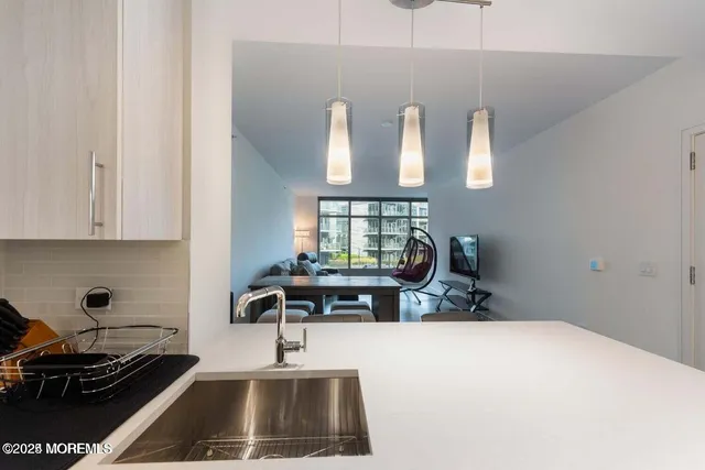 a kitchen with a stove and a wooden cabinets