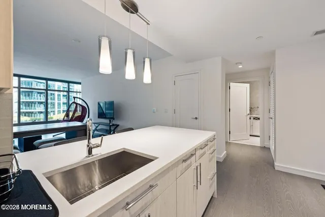 a living room with a table and a fireplace