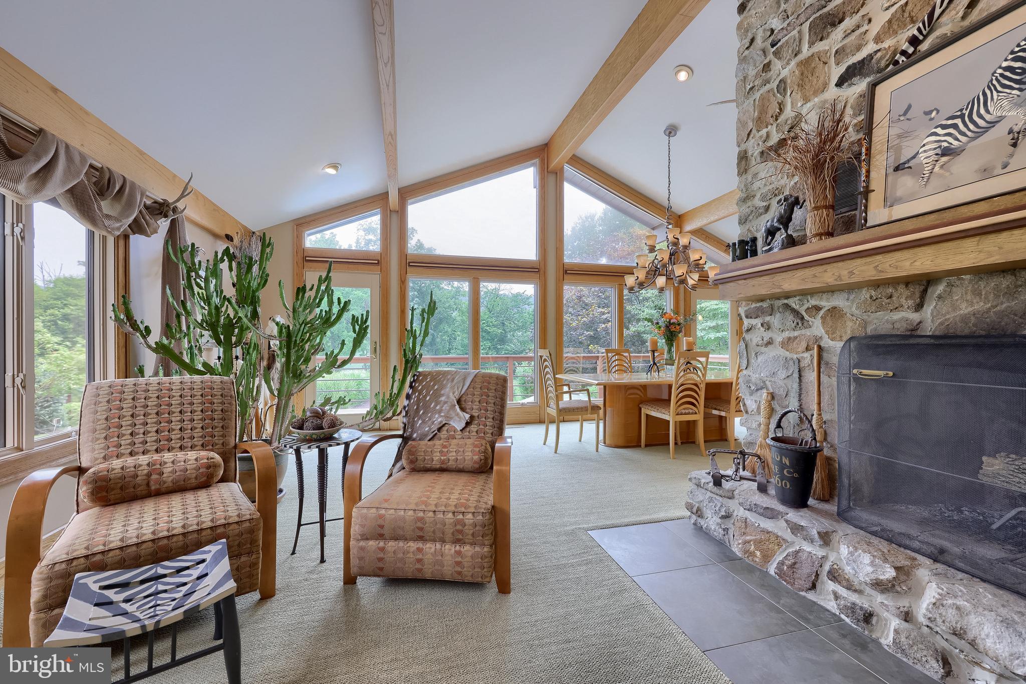 5776 Pheasant Run Road Hellam, PA 17406 - Photo 2 of 56 a living room with furniture and a floor to ceiling window