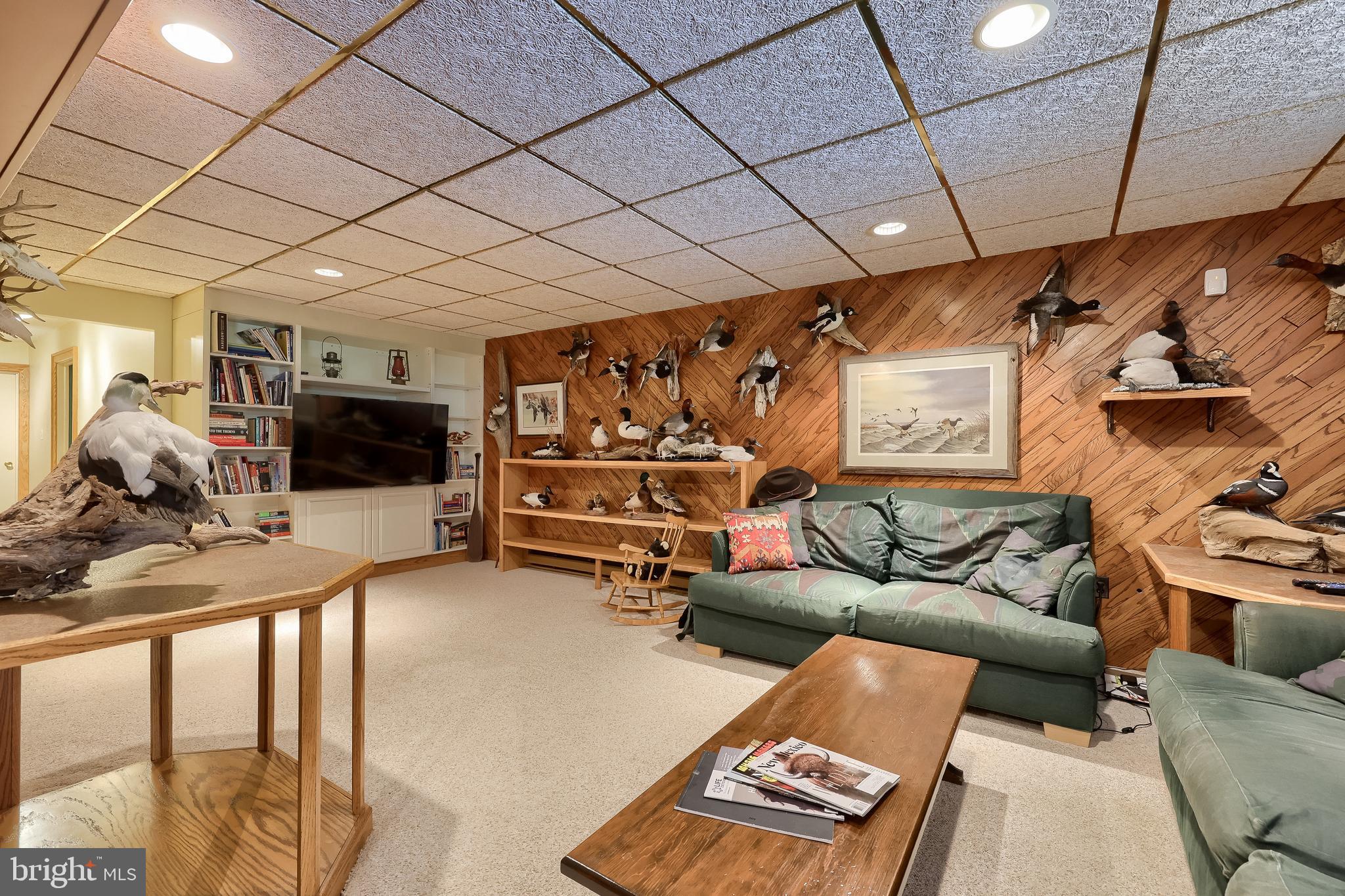 5776 Pheasant Run Road Hellam, PA 17406 - Photo 29 of 56 a living room with furniture a couch and a flat screen tv