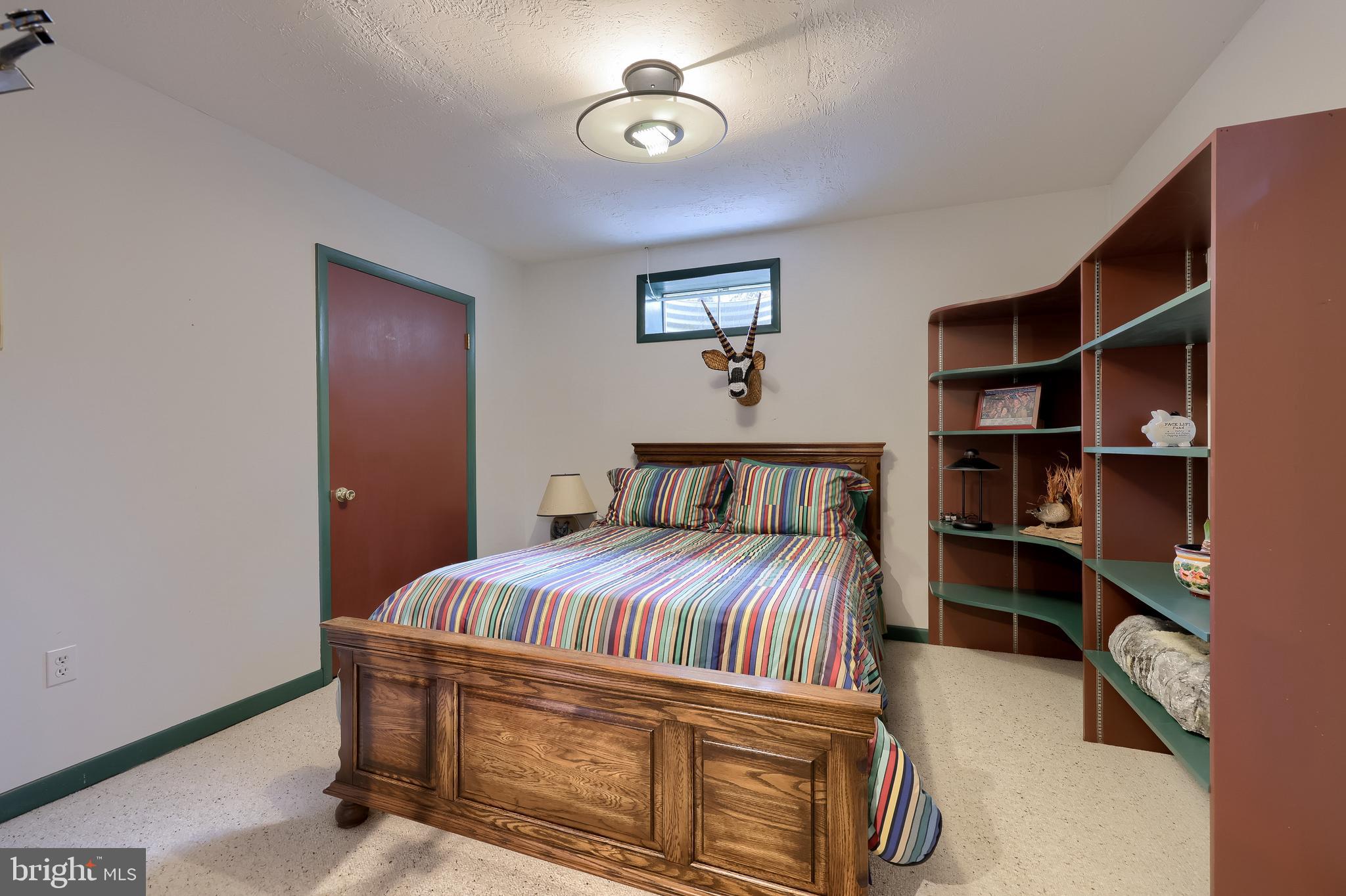 5776 Pheasant Run Road Hellam, PA 17406 - Photo 35 of 56 a bedroom with a bed and closet