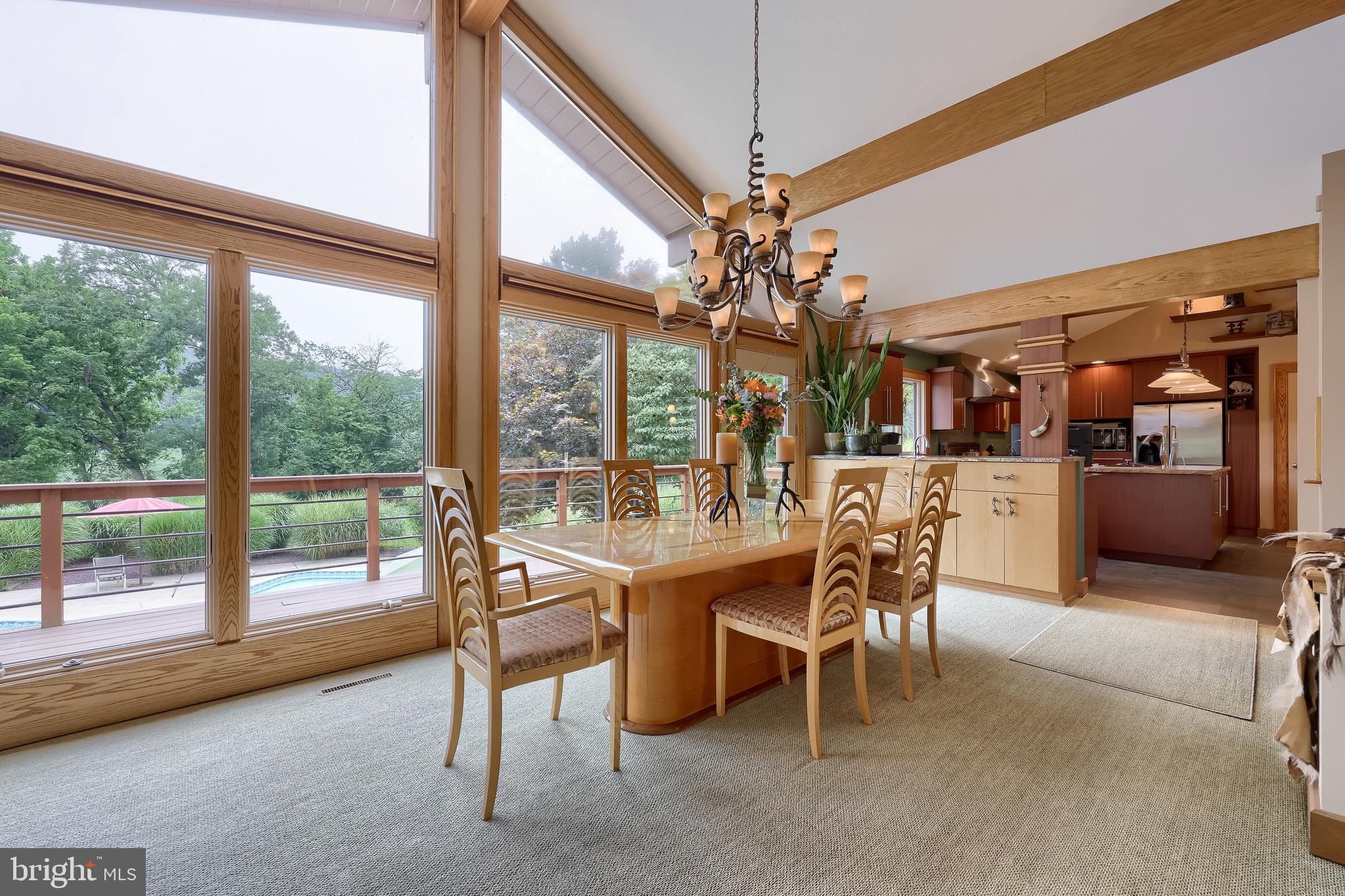5776 Pheasant Run Road Hellam, PA 17406 - Photo 10 of 56 a view of a dining room with furniture large windows and wooden floor