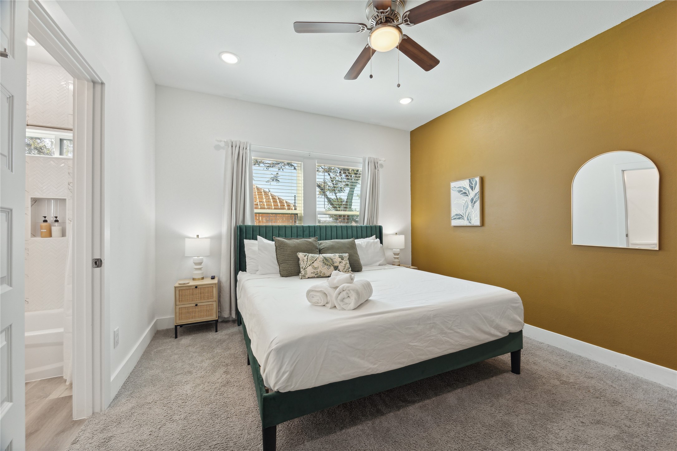 3828 Noah Street, Unit B Houston, TX 77021 - Photo 8 of 10 a bedroom with a bed and a chandelier