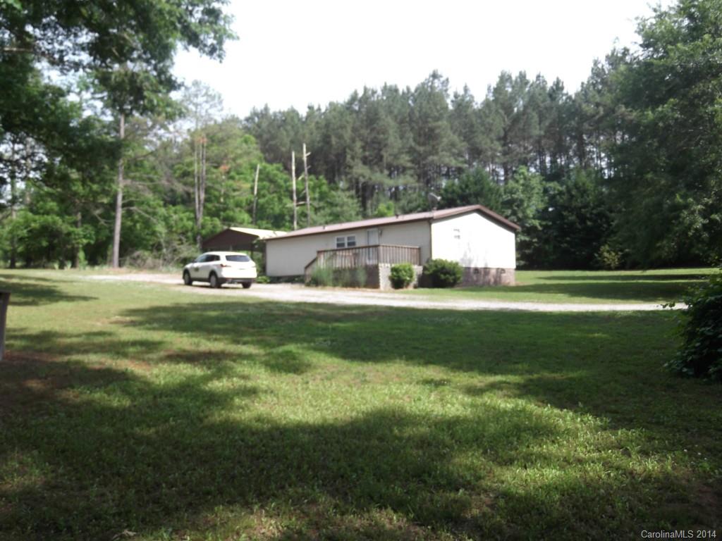 5664 Bill Sain Road Vale, NC 28168 - Photo 3 of 24 a front view of a house with garden and trees