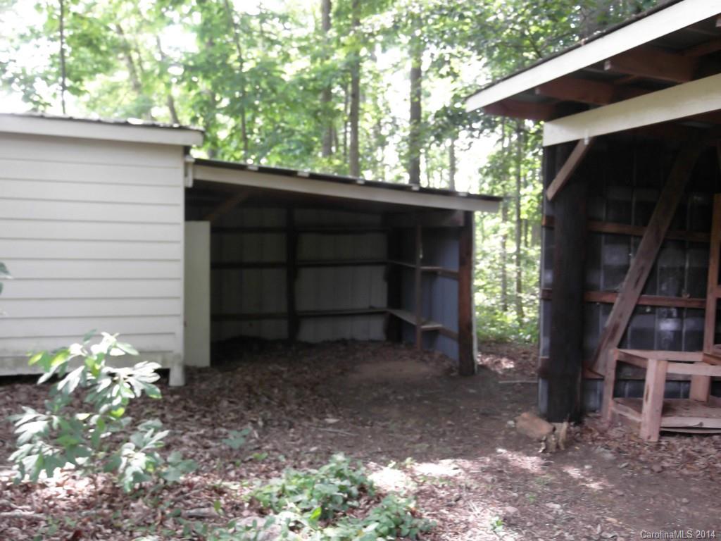 5664 Bill Sain Road Vale, NC 28168 - Photo 5 of 24 a front view of a house with a yard and garage
