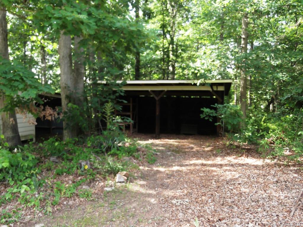 5664 Bill Sain Road Vale, NC 28168 - Photo 6 of 24 a backyard of a house with lots of green space