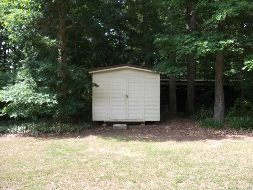5664 Bill Sain Road Vale, NC 28168 - Photo 7 of 24 a house with trees in front of it